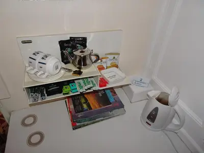 a small kitchen with a table with a tea pot on it at Ivy House B&B in Dolgellau