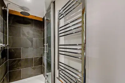 a bathroom with a shower and a toilet at 1 Bed in Brithdir oc-w30045 in Rhydymain
