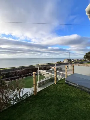 a view of the ocean from the balcony of a house at Bryn Glasfor in Barmouth