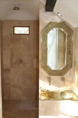 a bathroom with a sink and a mirror at Mellow Mountain Eco Retreat Wales Hot-Tub Sauna in Glyn-Ceiriog