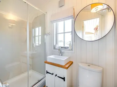 a white bathroom with a sink and a mirror at Sunflower - Uk42360 in Saint Harmon