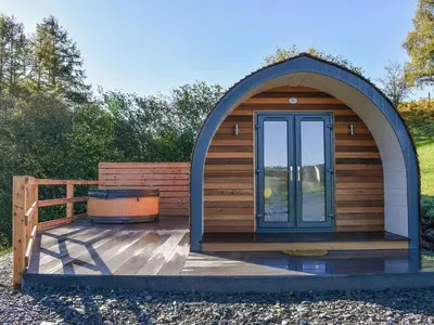 a gazebo with a grill on a wooden deck at Glampio Trysor Merddwr-Ukc5826 in Llangwm