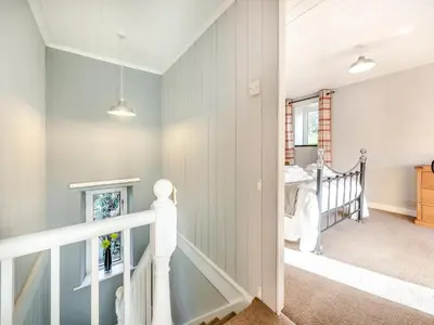 a room with a staircase leading to a bedroom at East Llwyn - Uk41756 in Rhyd Owen