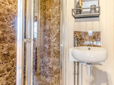 a bathroom with a sink and a shower at Mayflower - Uk42359 in Saint Harmon
