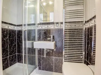 a bathroom with a toilet and a sink at Apartment 2 in Aberdyfi