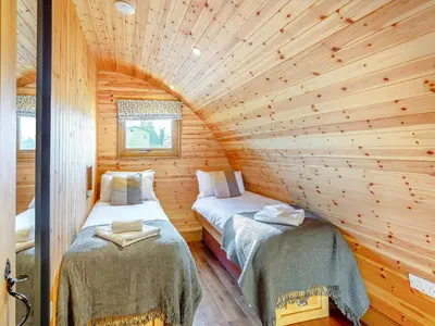 a room with two beds in a log cabin at Primrose - Uk42358 in Saint Harmon