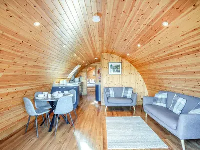 a room with a wooden ceiling with a table and chairs at Primrose - Uk42358 in Saint Harmon