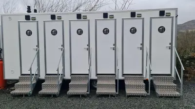 a row of washing machines sitting next to each other at Bunkhouse Accommodation in the Heart of Snowdonia in Dolgellau