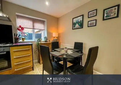 a dining room with a table and chairs at 2 Bedroom Home near Theatre Severn with Parking in Shrewsbury