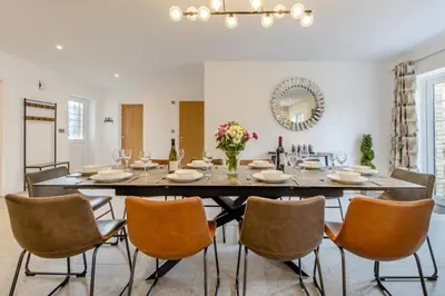 a dining room with a large table and chairs at 4 Bed in Capel Bangor oc-m30145 in Capel Bangor