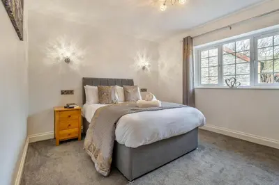 a bedroom with a large bed and a window at 4 Bed in Capel Bangor oc-m30145 in Capel Bangor