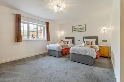 a bedroom with two beds and a window at 4 Bed in Capel Bangor oc-m30145 in Capel Bangor