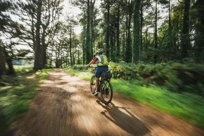 a person riding a bike down a dirt road at 1 Bed in Llanerfyl oc-d30168 in Llanfair Caereinion