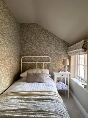 a bedroom with a bed in a room with a wall at Charming Townhouse Retreat in Shrewsbury