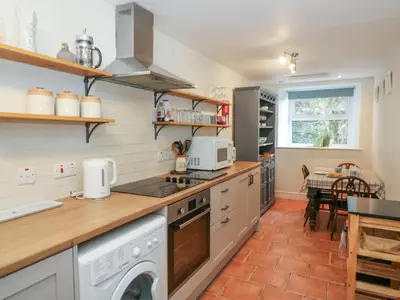 a kitchen with a washer and dryer at Pengraig in Tregaron