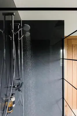 a shower with a stream of water in a bathroom at Finest Retreats - The Welsh Barn in Aberystwyth