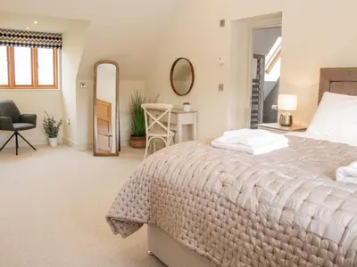 a bedroom with a bed and a desk and a chair at White House in Montgomery
