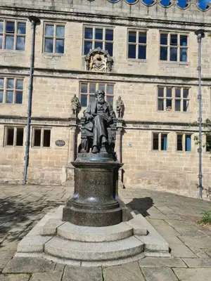 a statue of a man in front of a building at Cosy Corner - Town centre flat with free nearby parking in Shrewsbury