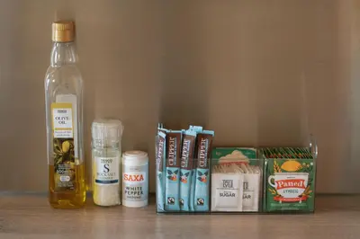 a table with a bottle of oil and some medicines at Knighton by Wigwam Holidays in Knighton