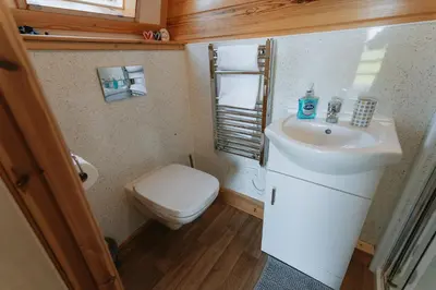 a bathroom with a sink and a toilet at Knighton by Wigwam Holidays in Knighton