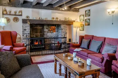 a living room with couches and a fireplace at 7 Bed in Talgarth oc-h30349 in Talgarth