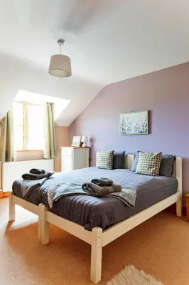 a bedroom with a large bed in a room at Finest Retreats - The Welsh Farmhouse in Aberystwyth