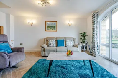 a living room with a couch and a table at 2 Bed in Capel Bangor oc-m30146 in Capel Bangor