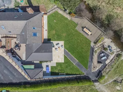 an aerial view of a house with a yard at 5 Bed in Pant-y-Dwr oc-w30200 in Pant-y-dwr