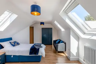 a bedroom with a bed and a tv in a attic at 5 Bed in Pant-y-Dwr oc-w30200 in Pant-y-dwr