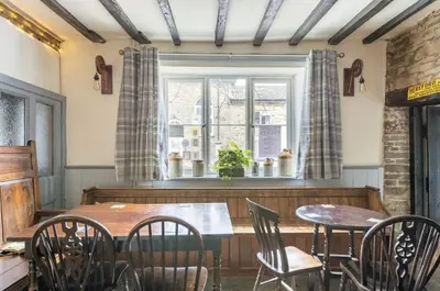 a dining room with a table and chairs and a window at The Royal Oak, Gladestry in Gladestry