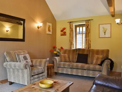 a living room with two chairs and a couch at Piglets Place - E4300 in Halston