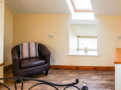 a leather chair in a room with a window at Hirnant - Uk48512 in Bala