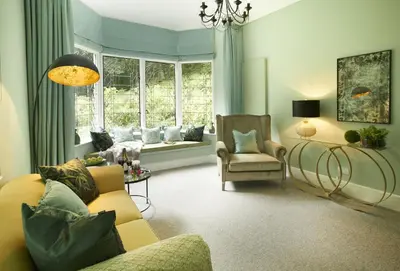 a living room with a couch and a chair at Bull Hollow Cottage in Shrewsbury