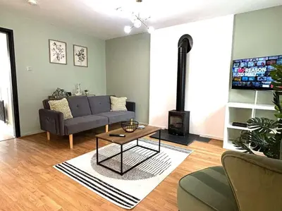 a living room with a couch and a coffee table at Shrewsbury Stayscape - Modern & Spacious 3BR - Family & Business Ready for 7 by Parydise Properties in Bicton