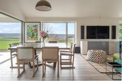 a kitchen and dining room with a table and chairs at 1 Little Broomcroft in Shrewsbury