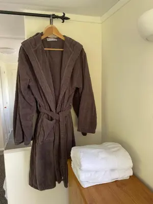 a robe is hanging on a rack in a room at Fabulous Hot Tub with Views! in Llanfair Caereinion