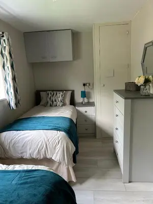 a small bedroom with a bed and a dresser at Dog & Family Friendly Private Cottage in Orleton in Orleton