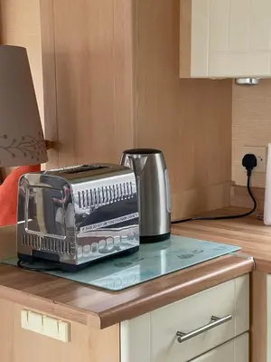 a toaster sitting on top of a kitchen counter at The Perfect Escape 2 Bedroom Static Caravan Pet Friendly in Aberystwyth