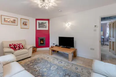 a living room with a couch and a tv at 2 Bed in Woofferton oc-b29941 in Woofferton