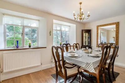 a dining room with a table and chairs at 3 Bed in Scethrog oc-h30013 in Scethrog
