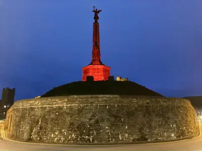 a statue on top of a building with a tower at Luxury 2 bedroom town apartment in Aberystwyth