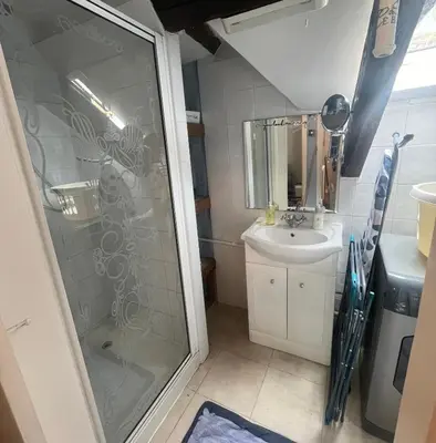 a bathroom with a shower and a sink at Top Cottage Barmouth in Barmouth