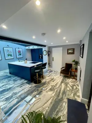 a large living room with a tub and a sink at Stunning fully refurbished house in New Quay