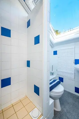 a bathroom with a toilet and a sink at Aberdovey Sea View Apartment in Aberdyfi