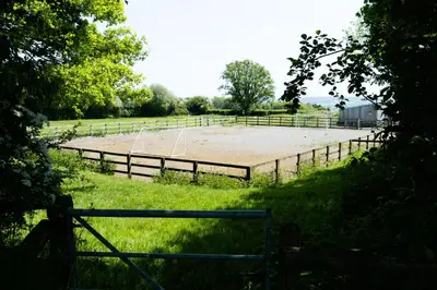 a volleyball court in a field with a fence at Welsh Border Escape- Perfect for families & groups in Clyro