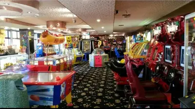 a room filled with lots of arcade games at Sea View Escape 2 Bedroom Pet Friendly Caravan at Clarach Bay Gm3 in Aberystwyth