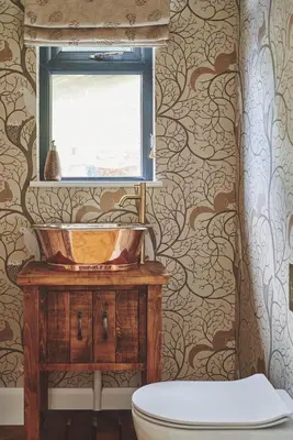 a bathroom with a sink and a window at Upper Tumble Cottage in Montgomery