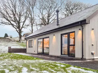 a house with large windows on the side of it at Root - Uk47733 in Mochdre