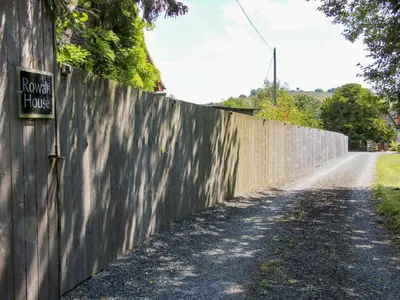 a fence with a sign on the side of a road at Stiper View Barn 1 in Shrewsbury
