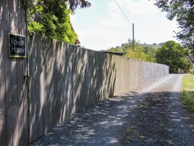 a fence with a sign on the side of a road at Stiper View Barn 2 in Shrewsbury